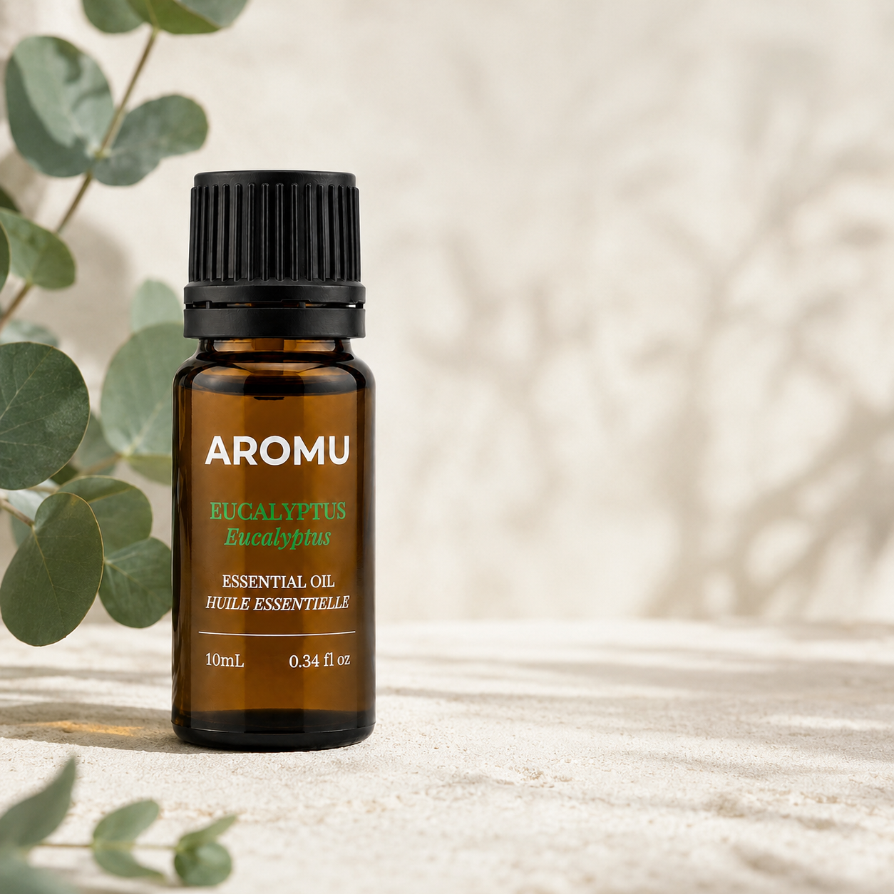 Eucalyptus Essential Oil with fresh eucalyptus leaves