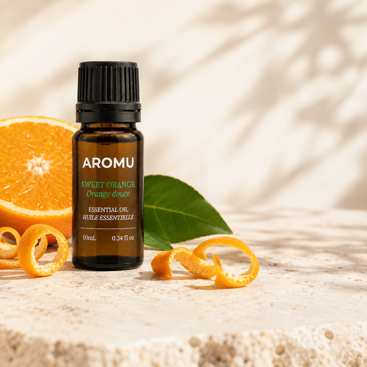 Sweet Orange Essential Oil with fresh orange and citrus leaves
