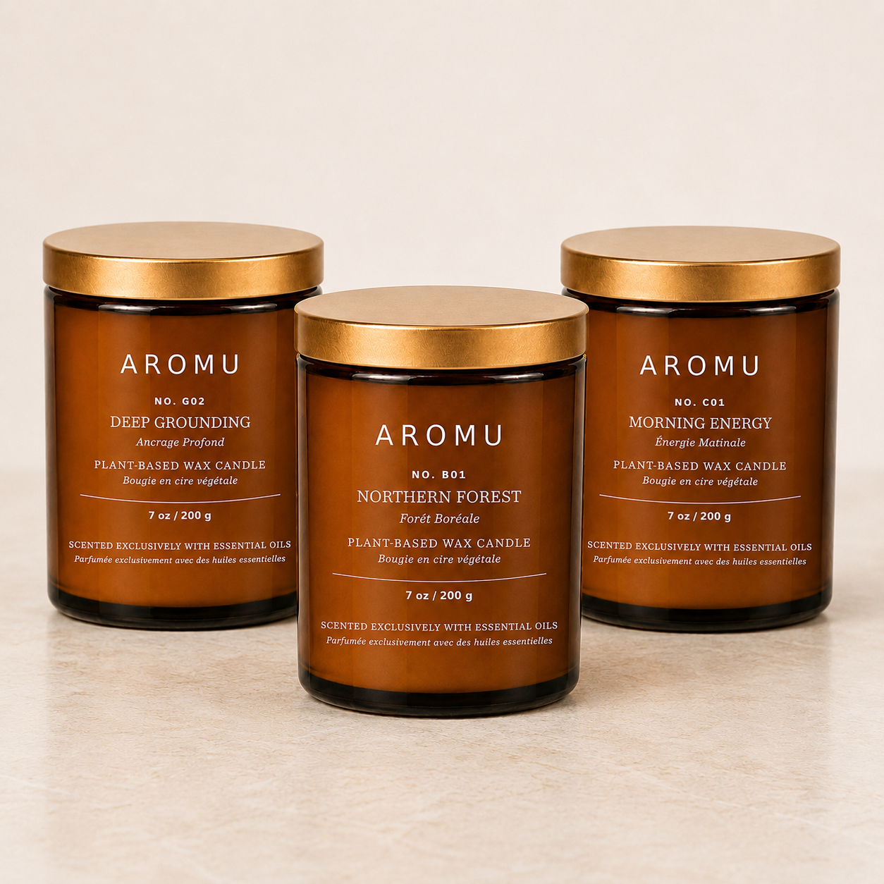 Three AROMU essential oil candles in the Gift Set for Him: Deep Grounding, Northern Forest and Morning Energy