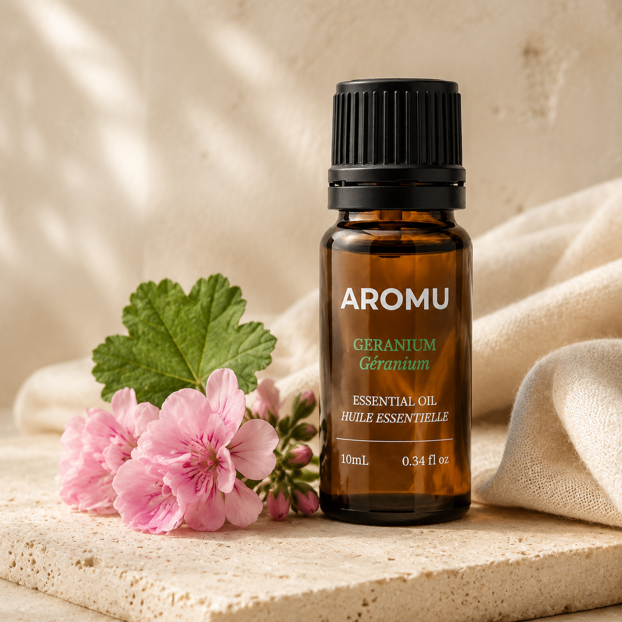 AROMU Geranium Essential Oil with pink geranium flowers
