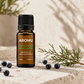 Juniper Berry Essential Oil with natural juniper berries and foliage