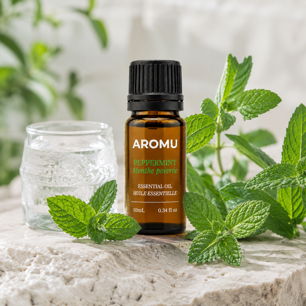 AROMU Peppermint Essential Oil with fresh peppermint leaves