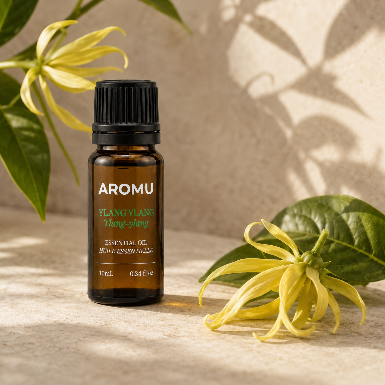 Ylang Ylang Essential Oil with natural ylang-ylang flowers