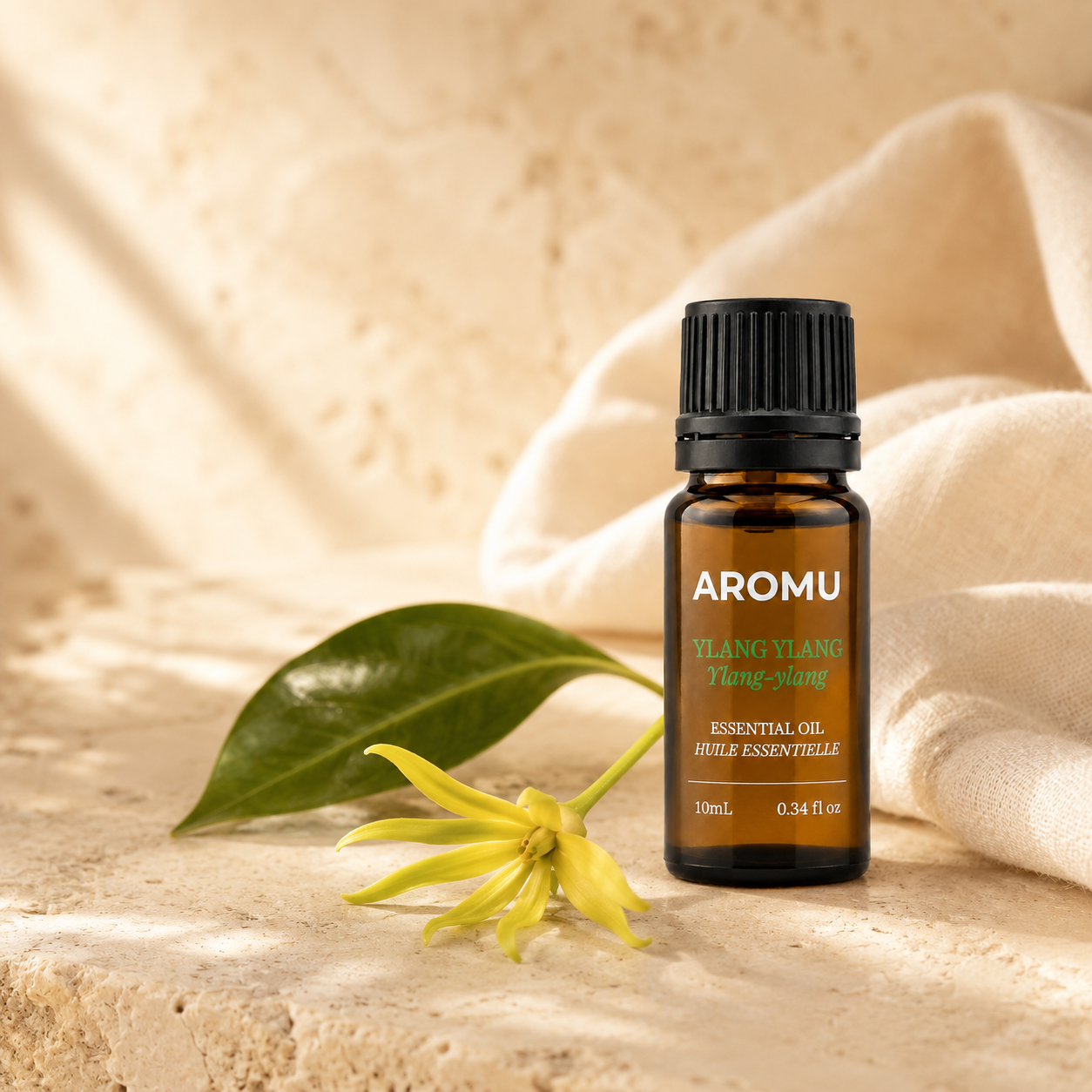 AROMU Ylang Ylang Essential Oil in warm natural light